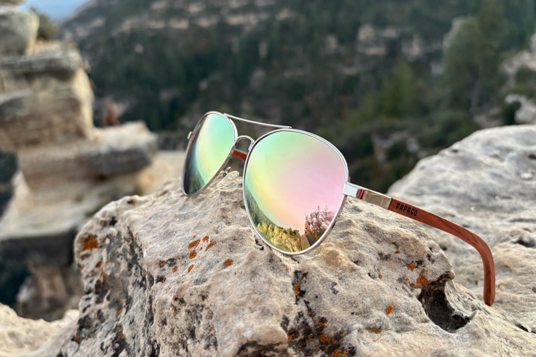 sustainable red wood aviator sunglasses on cliff in flagstaff