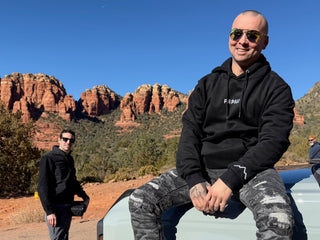 guys hanging out in sedona wearing premium wooden sunglasses and black hoodie