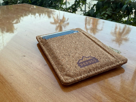 biodegradable cork wood wallet on a table outside to keep money and cards safe