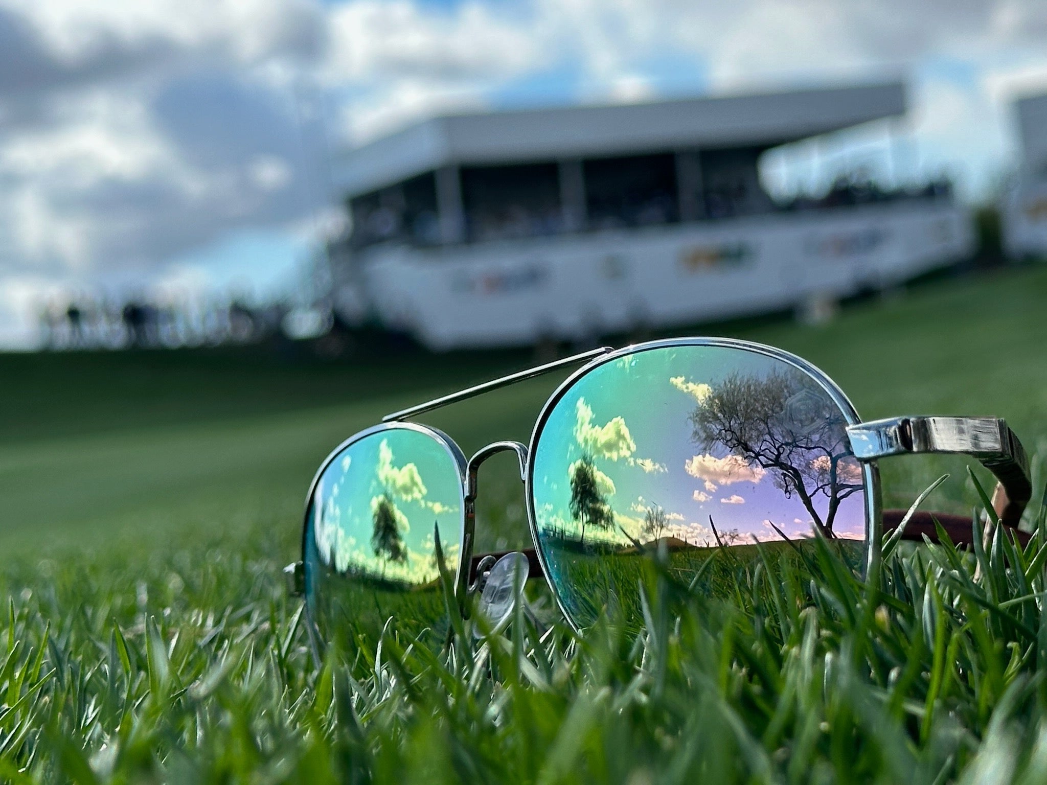 sustainable wooden aviator sunglasses at golf tournament